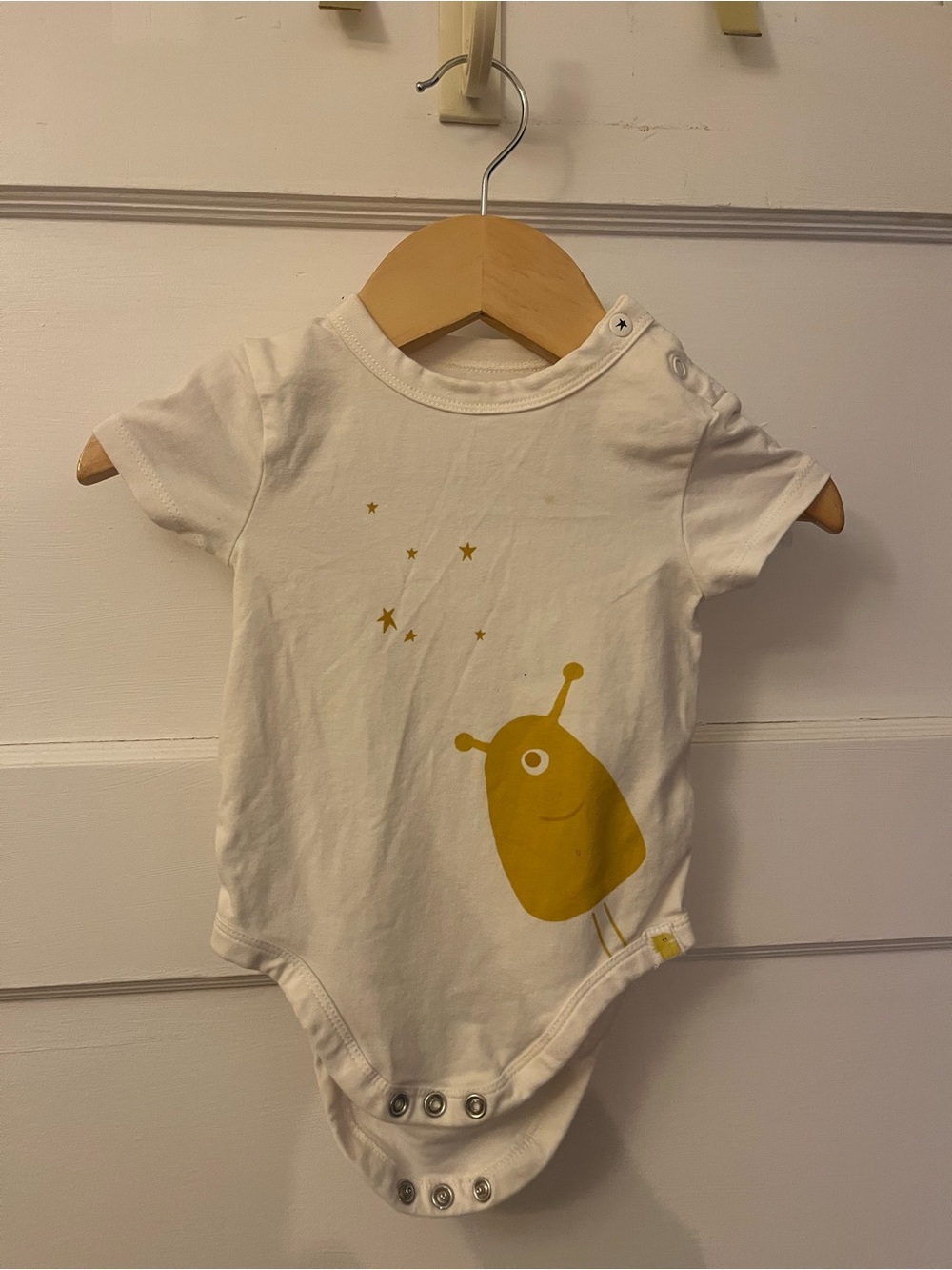 Rise little Earthling baby onesie with graphic